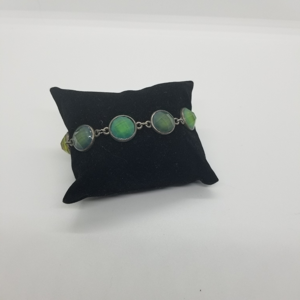 silver tone toggle bracelet with green faceted cabochons